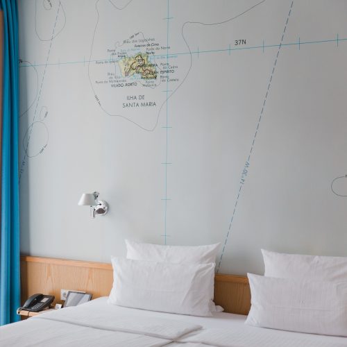 Hotel room with map wallwaper