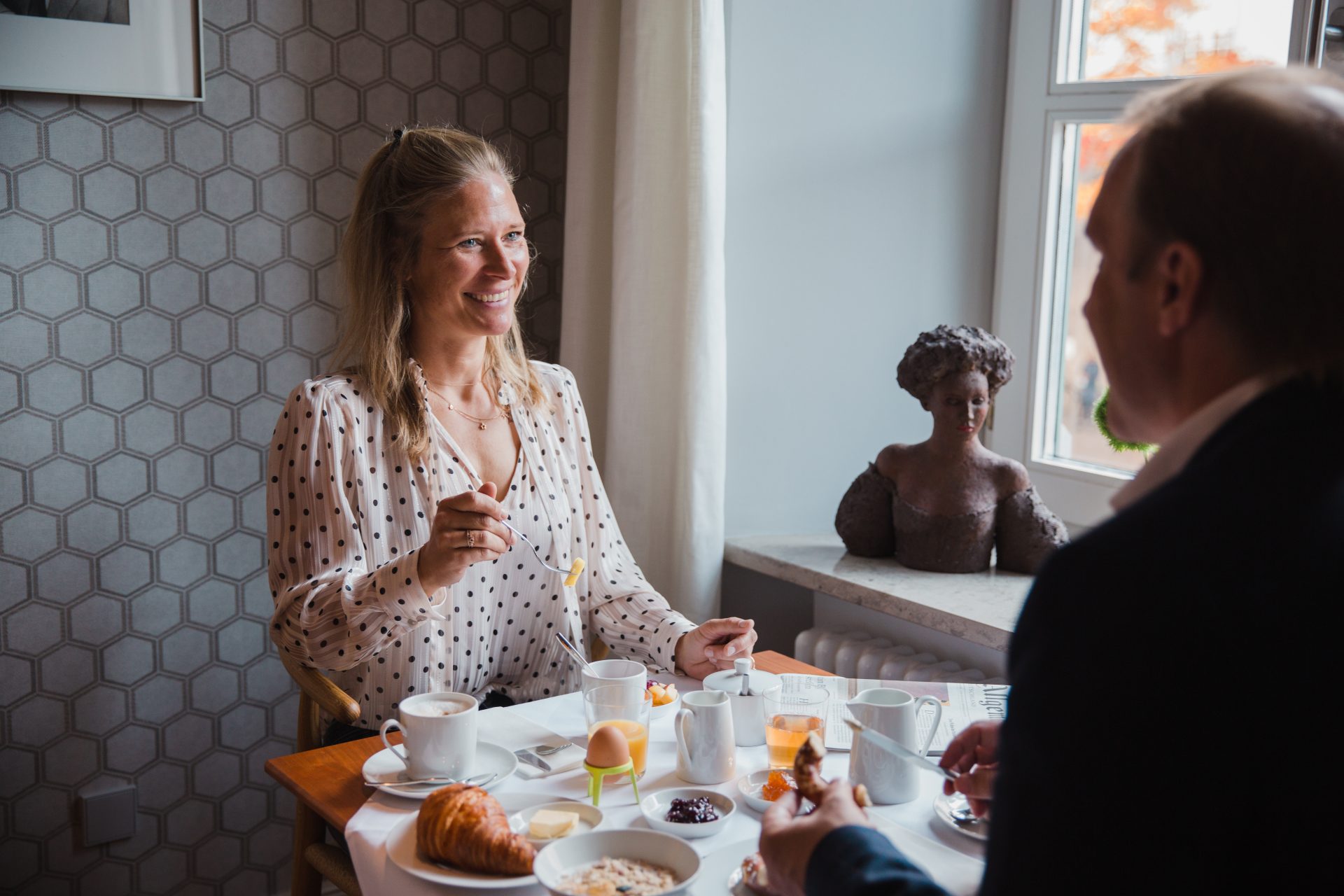 Two people having breakfast in the hotel